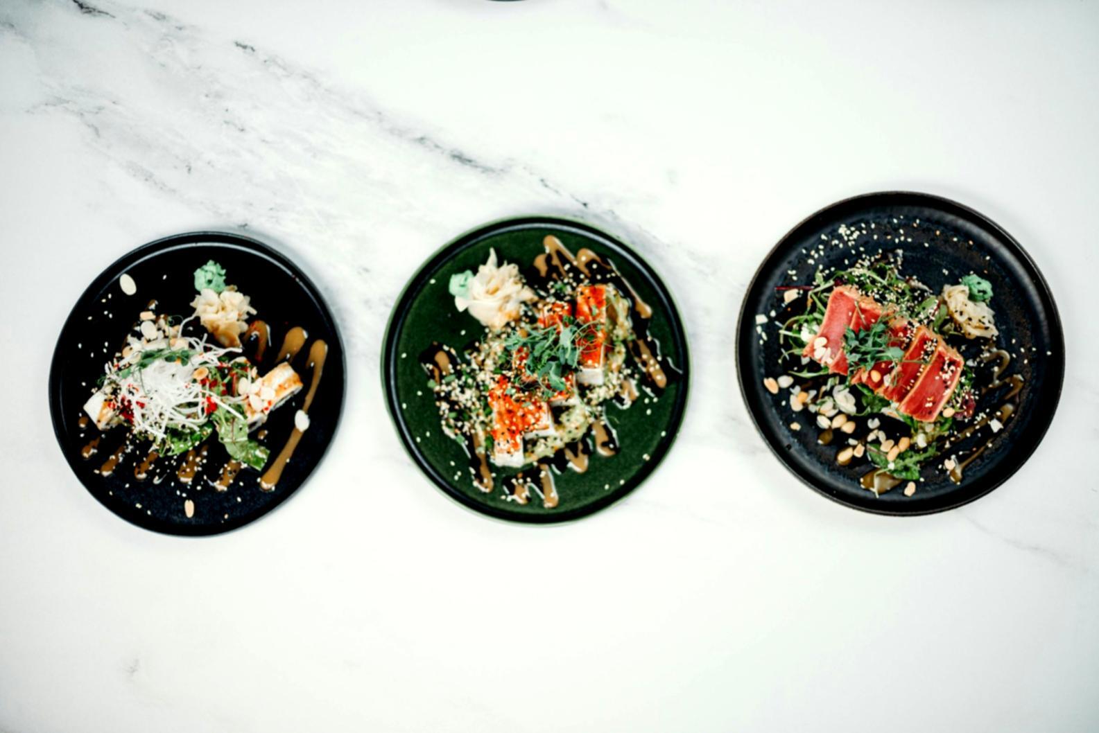 Culinary arts student practicing professional cooking techniques in modern kitchen environment