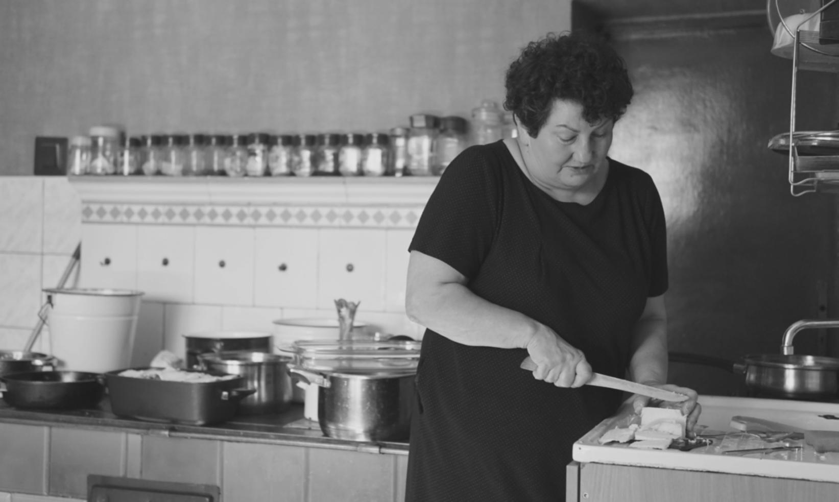 Culinary instruction session showing hands-on technique demonstration